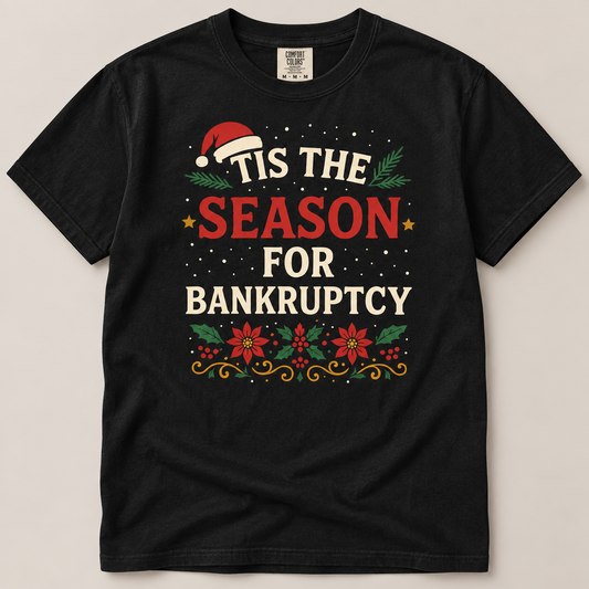 A black short-sleeve crewneck t-shirt with a festive Christmas-themed graphic that reads 'TIS THE SEASON FOR BANKRUPTCY' in red and cream lettering, decorated with a Santa hat, pine branches, stars, and poinsettias, shown flat against a light beige background.
