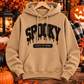 Meerkat tan Spooky State of Mind heavyweight pullover hoodie with raised black puff vinyl lettering on a Halloween-themed background